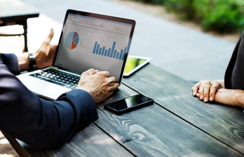 man on laptop using analytics tools